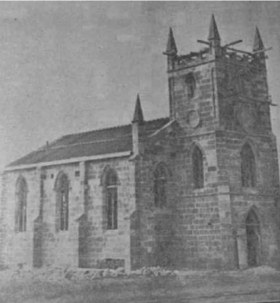 Black and white photograph of the church being rebuilt on McKern St, roof not yet finished
